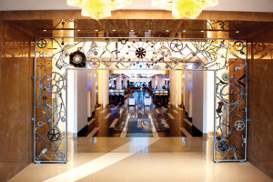 A sculpted iron archway designed by folk legend Bob Dylan leads guests onto the casino floor. 